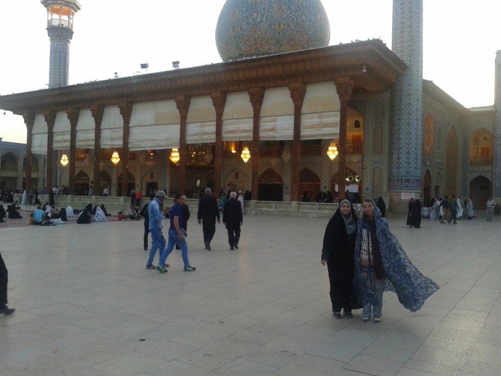 Cora and her guide inside the mosque's backyard