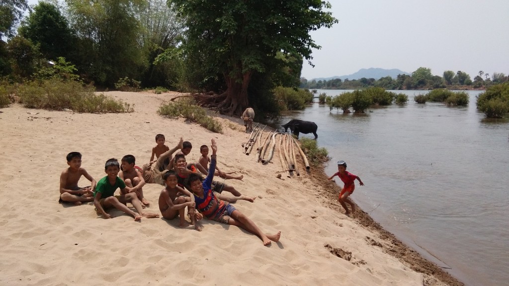 Boys diving for fish with harpunes