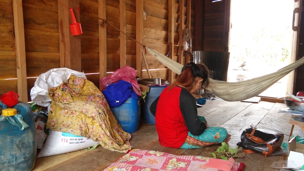 Woman in hut with baby...