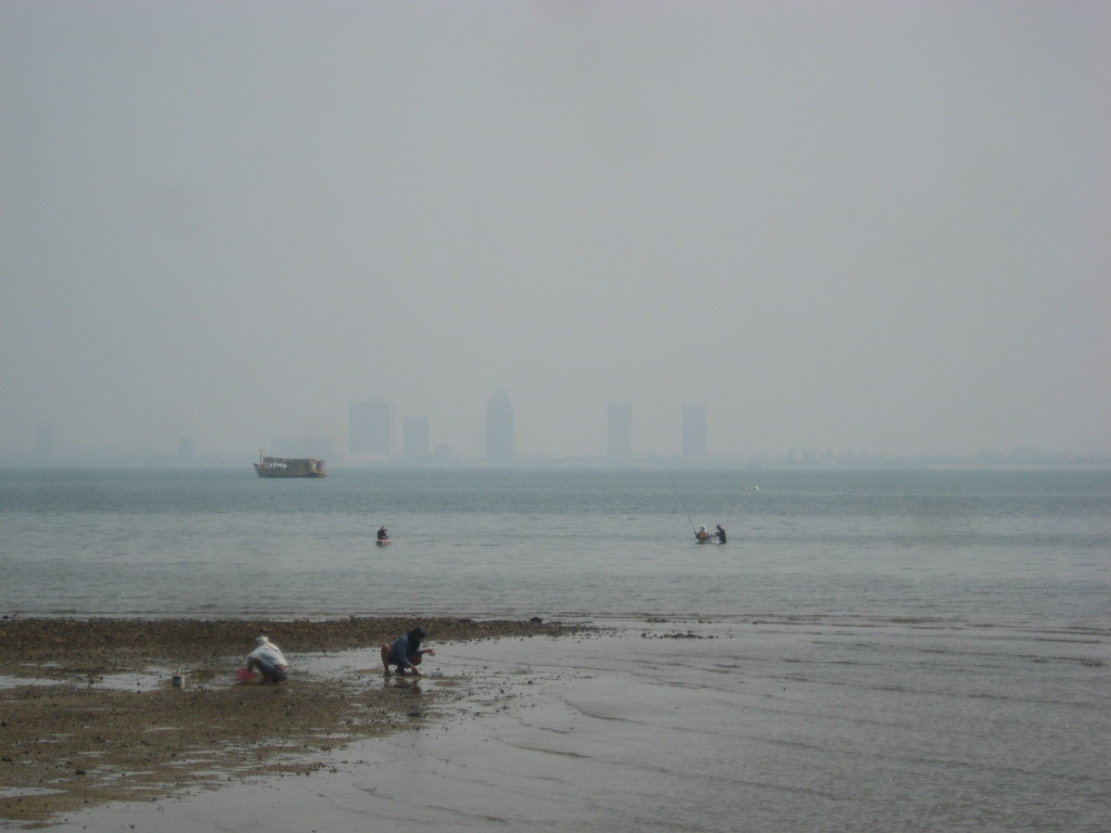 Fisherman in front of the skyline of Pattaya