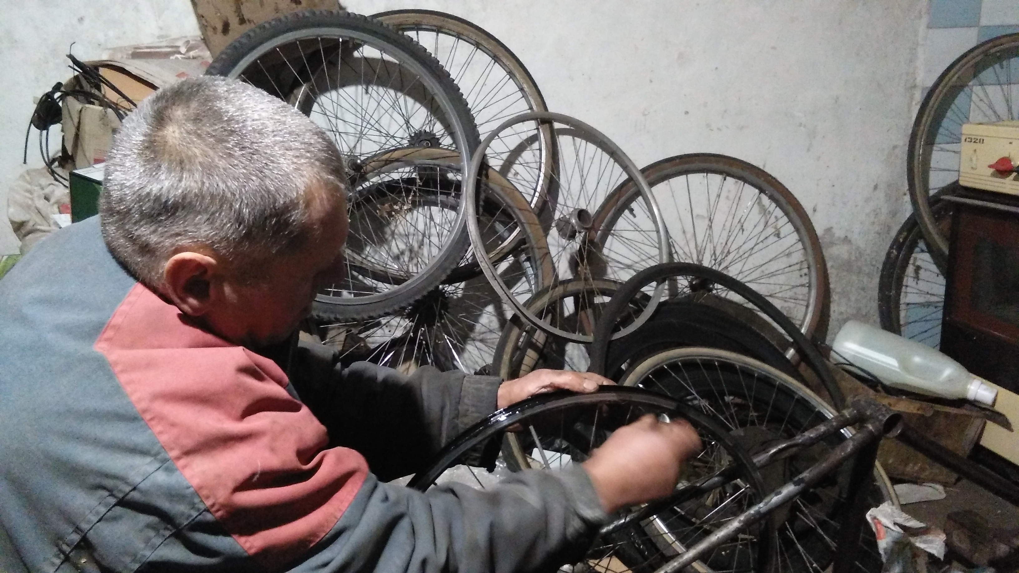 Vladimir fixing my wheel in his workshop